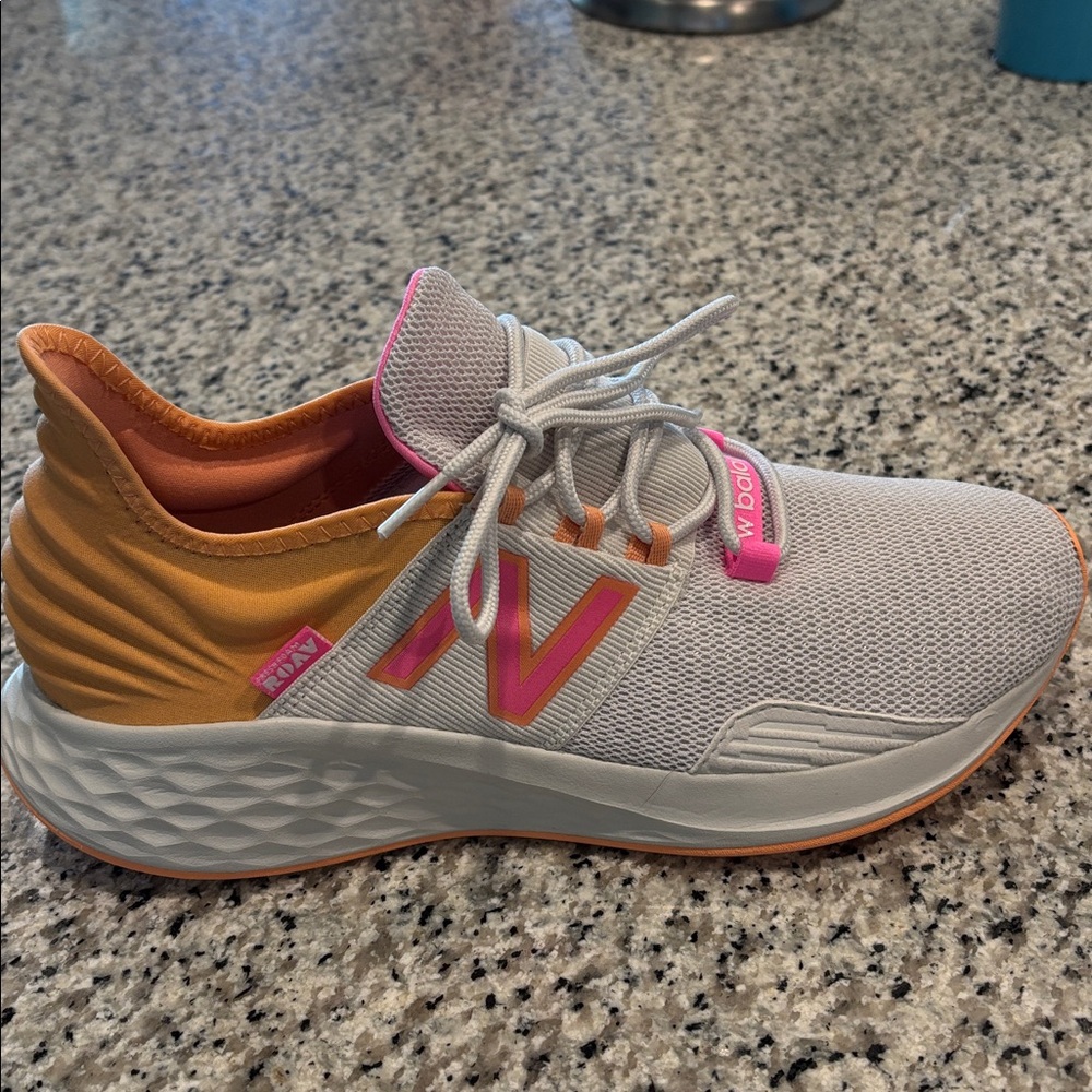New Balance Women's white, pink and orange shoes.